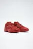 A pair of red Reebok women's leather sneakers, Cardi B Club C V2, are displayed on a white background. Voir les images du produit