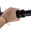 A hand is gripping a black bar with foam padding, likely a pull-up bar. Anteprima dell’immagine prodotto