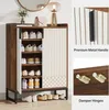A shoe cabinet with multiple shelves and a sliding door, showcasing its features and design. Náhľad obrázku produktu