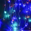 A close-up view of colorful LED string lights hanging vertically against a dark, blurred background. Anteprima dell’immagine prodotto