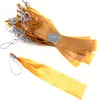 A bundle of brown paper sausage casings tied with blue and white twine, with one casing separated and laid out. Produktbild-Vorschau