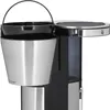 Close-up view of the top section of a coffee maker, focusing on the filter basket and water reservoir. Voir les images du produit