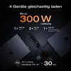 A dark background with laptops, a power bank, and a phone, illustrating charging capabilities. Produktbild-Vorschau