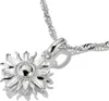 A close-up shot of a silver sun-shaped pendant necklace on a white background. Anteprima dell’immagine prodotto