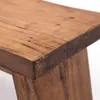 Close-up view of a wooden stool's corner and surface. Produktbild-Vorschau