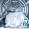 Inside a dryer drum with a white towel and a product package. Anteprima dell’immagine prodotto