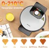 A waffle maker is shown on a wooden table, with a glass of batter and a plate of waffles in the foreground. Several heart-shaped waffles with different levels of browning are displayed below. Produktbild-Vorschau
