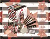 A Christmas advent calendar filled with makeup products, displayed with the individual items laid out around it. Produktbild-Vorschau