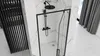 A modern bathroom with a black framed shower enclosure. Náhľad obrázku produktu