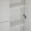Interior view of a white cabinet with shelves and a hinge. Podgląd zdjęcia produktu