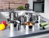 A collection of stainless steel pots and pans on a kitchen countertop. Produktbild-Vorschau