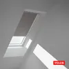 A VELUX skylight with a gray roller blind partially drawn. Produktbild-Vorschau