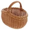 A woven basket with a handle, presented against a white background. Produktbild-Vorschau
