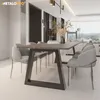A modern dining room with a table and chairs. Produktbild-Vorschau