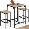 A three-piece bar set consisting of a table and two stools, with decorative items on the table. Produktbild-Vorschau