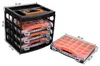A black plastic organizer with three drawers, each containing orange compartments, is shown next to a single drawer unit. Dimensions are indicated by white text on black labels. Produktbild-Vorschau