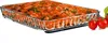 A rectangular glass baking dish filled with food, with cherry tomatoes and a basil leaf on the side. Produktbild-Vorschau
