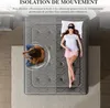 A top-down view of a mattress with two people on it, one sleeping and one sitting up. Voir les images du produit