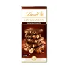 A stack of dark chocolate bars with hazelnuts. Produktbild-Vorschau