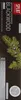 A close-up of a black toothpaste box with green pine branches and berries. Produktbild-Vorschau