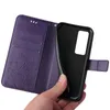 A hand is holding a purple flip phone case open, revealing the inside compartments and the phone holder. Produktbild-Vorschau