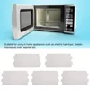 A microwave oven with its door open, and a set of five rectangular inserts below. Náhled obrázku produktu