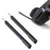 Two black microphone attachments with 3.5mm connectors are shown in the foreground, with a portion of a black gaming headset visible in the background. Voir les images du produit