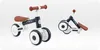 Two MoMi DEX foldable 2-in-1 balance bikes/tricycles without pedals are displayed against a white background. One is shown from the side, and the other is shown from a slightly elevated front-side angle. Produktbild-Vorschau