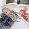 zwijane etui kokonote z botanicznymi dzikimi kwiatami Podgląd zdjęcia produktu 6
