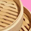 A close-up view of two stacked bamboo steamers. Produktbild-Vorschau