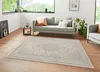 A living room scene with a sofa, armchair, and a rug. Produktbild-Vorschau