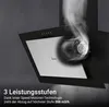 A close-up of a range hood with smoke being extracted, highlighting its features. Produktbild-Vorschau