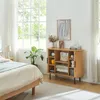 A bedroom scene with a bed, a plant, and a wooden cabinet. Podgląd zdjęcia produktu