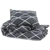 A folded duvet and pillow with a geometric pattern on a white background. Produktbild-Vorschau