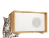 A cat sits next to a wooden and white insulated cat house. Produktbild-Vorschau