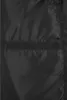 A close-up view of the inside lining of a black jacket, showing a pocket. Produktbild-Vorschau