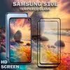 A Samsung S10e phone and tempered glass screen protector are displayed against a beach scene with rocks and waves. Produktbild-Vorschau
