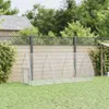 A silver metal animal enclosure with a mesh design sits on a green lawn in front of a wooden fence and trees. Voir les images du produit