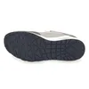 The underside of a sneaker is shown against a white background. Voir les images du produit