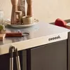 A close-up view of an outdoor serving cart with kitchen items on top. Produktbild-Vorschau