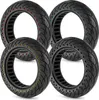 Four tires with colored dots arranged in a circle on a white background. Produktbild-Vorschau