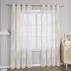 A window with sheer curtains and a floor lamp. Produktbild-Vorschau