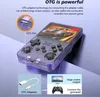 A transparent handheld game console with a car racing game displayed on its screen, shown with an OTG adapter and a diagram illustrating its connectivity features. Produktbild-Vorschau