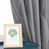 A framed picture with a botanical print sits on a dark blue tray in front of a gray curtain with a white wave pattern. Produktbild-Vorschau