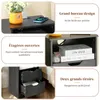 A collage of images showing different features of a nightstand, including its top surface with a phone and plant, its open shelves with books, and its drawers. Náhled obrázku produktu