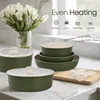 A kitchen counter with cookware and flowers. Produktbild-Vorschau