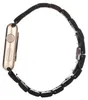 A side view of a gold Apple Watch with a black wooden band, isolated on a white background. Náhled obrázku produktu