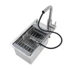 A stainless steel kitchen sink with a pull-out faucet and a drying rack. Náhled obrázku produktu