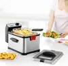 A person is serving a salad next to a deep fryer filled with french fries. Produktbild-Vorschau