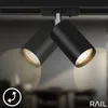 Close-up of a black track lighting system with two adjustable spotlights. Anteprima dell’immagine prodotto